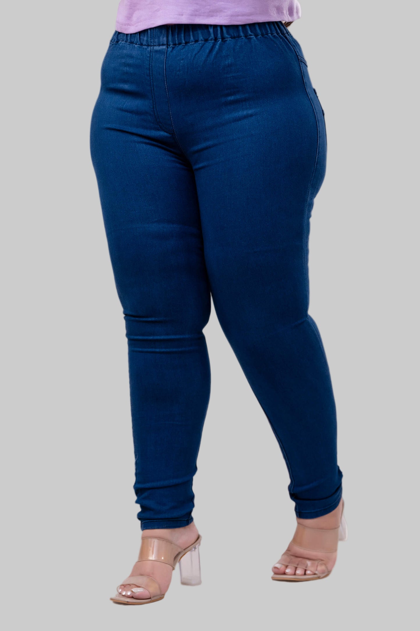 Three-quarter angle of blue jeggings for plus size and fat women with smooth pull-on fit – Curvisha