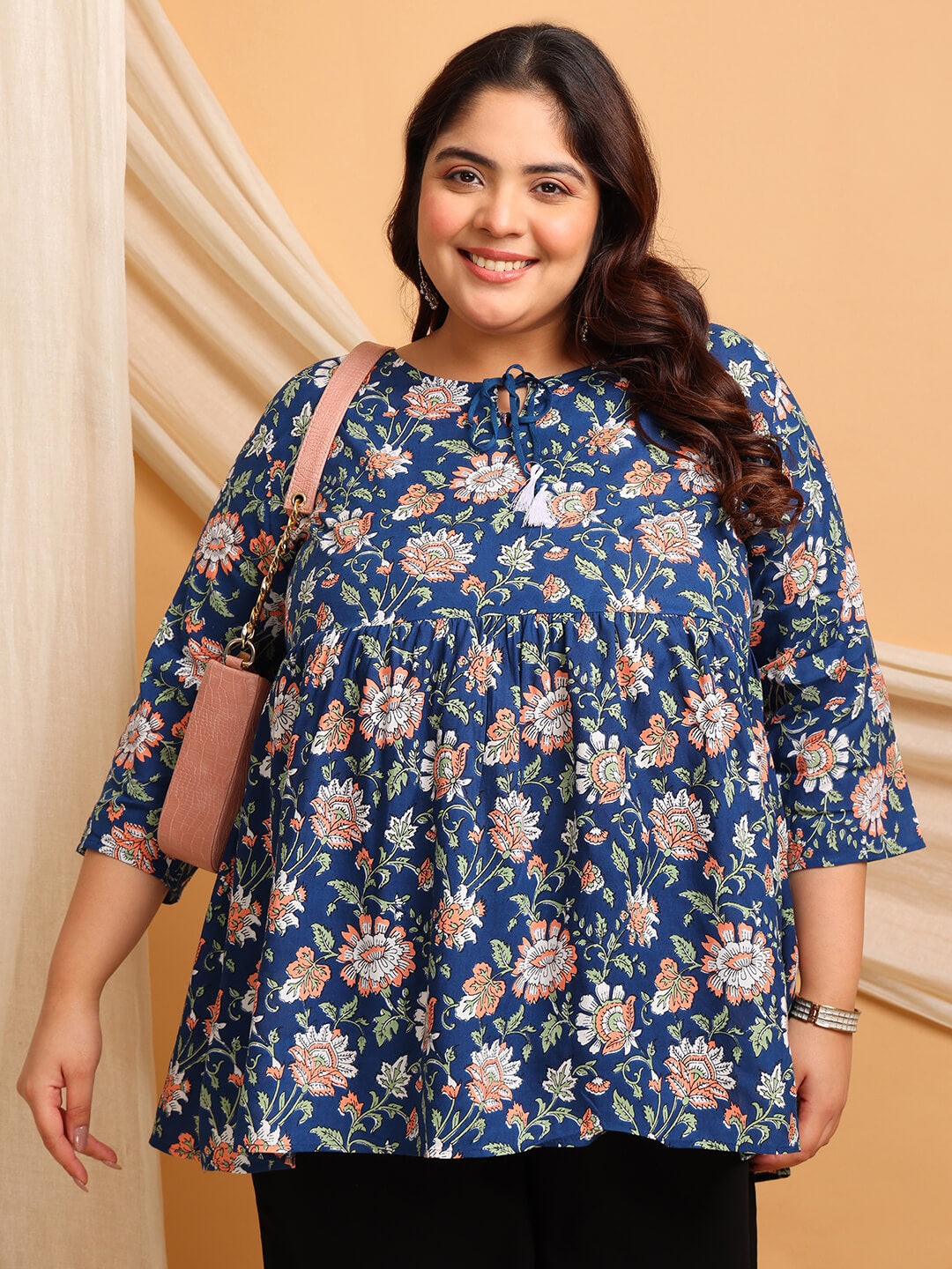 Side Angle of Plus Size Blue Floral Rayon Tunic with ¾ Sleeves and Flared Hem
