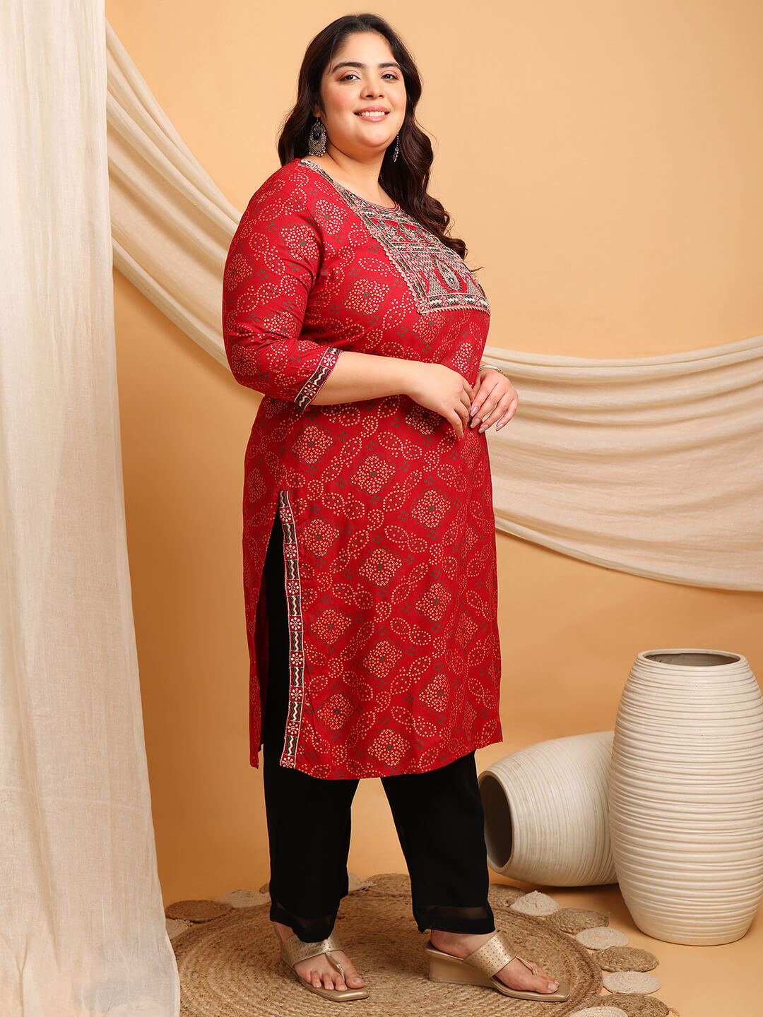 Curvy model smiling in red rayon kurti; comfortable plus size big size look, fat-friendly festive wear