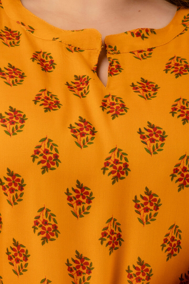 Notch-neck detail of mustard buta-print kurti; neat finishing and soft hand-feel; versatile ethnic basic.