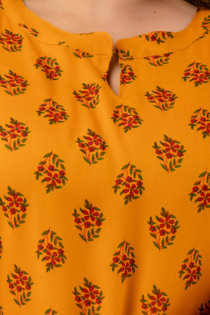 Notch-neck detail of mustard buta-print kurti; neat finishing and soft hand-feel; versatile ethnic basic.
