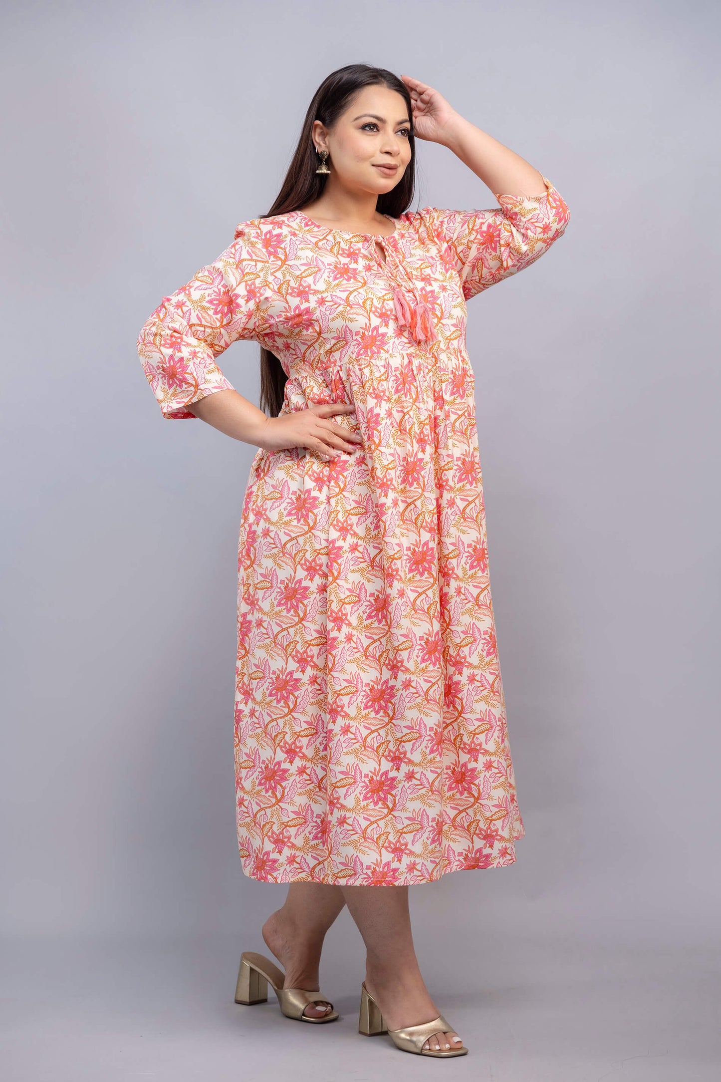 Side angle of peach pink floral rayon gathered gown for big size women