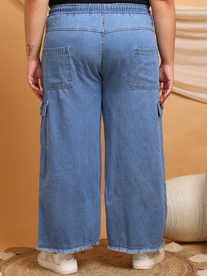 Back view of plus size denim cargo pants with elastic waistband and pockets