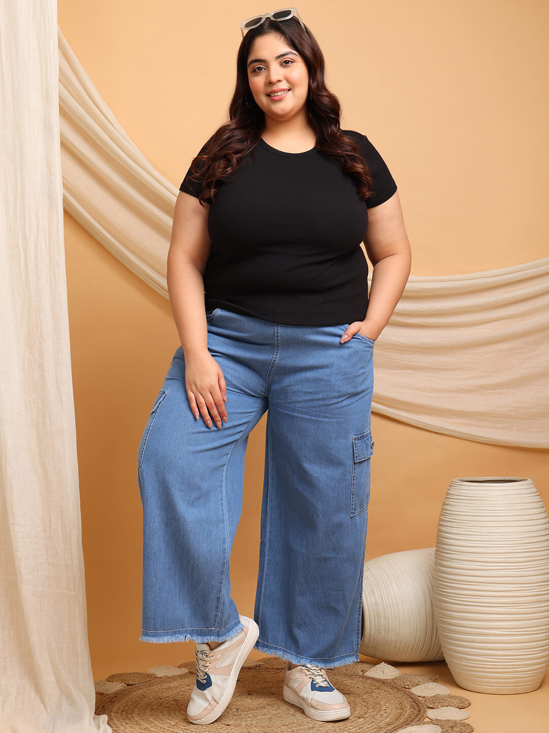 front view of blue denim cargo pants showing curvy woman wearing black tshirt– Curvisha