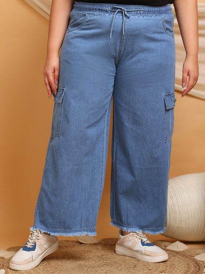 Front view of plus size blue denim cargo pants with wide leg and drawstring waist for curvy women – Curvisha