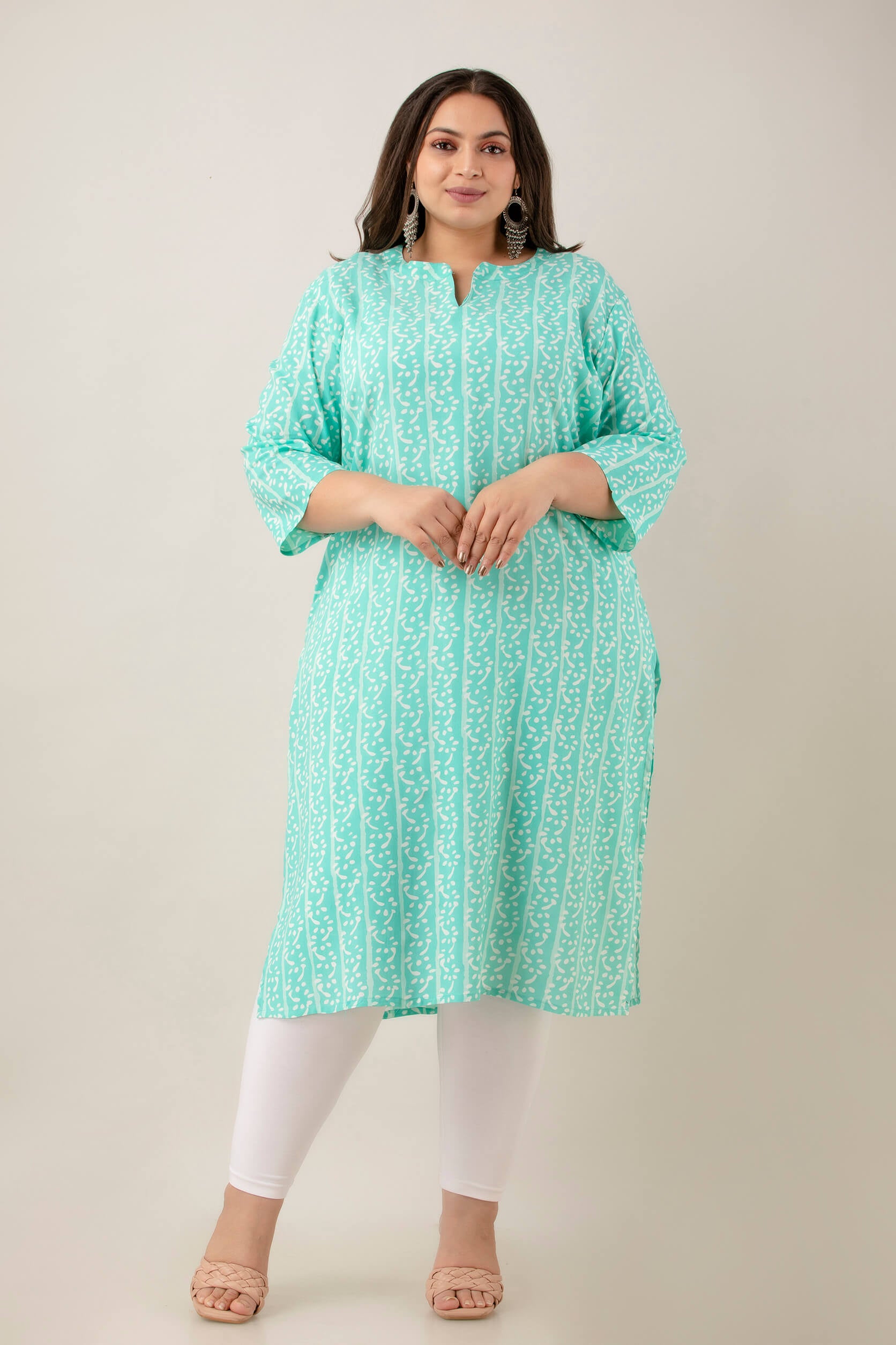 Front view mint/aqua rayon kurti with notch neck and 3/4 sleeves; soft vine stripes; smart workwear pick for curvy shoppers.