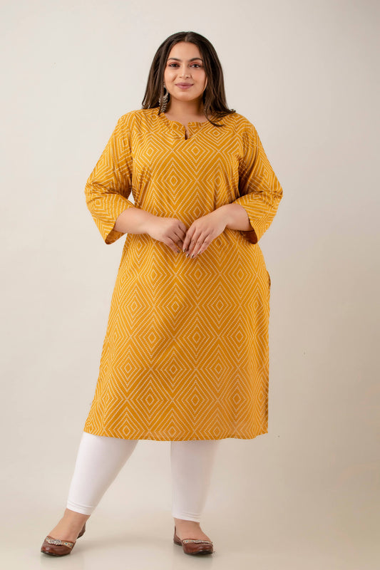 Front view mustard rayon kurti with notch neck and 3/4 sleeves; neat diamond-dot pattern; smart workwear option for curvy shoppers.