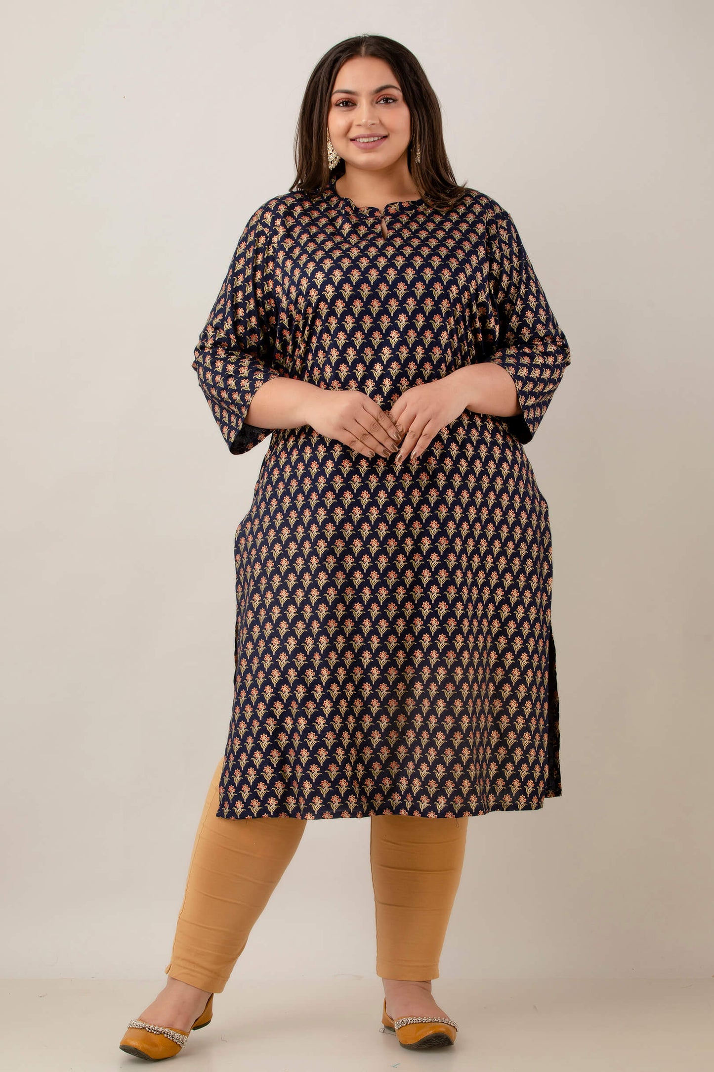 Front view navy blue rayon kurti with notch neck and 3/4 sleeves; elegant all-over buta motif; smart workwear pick.