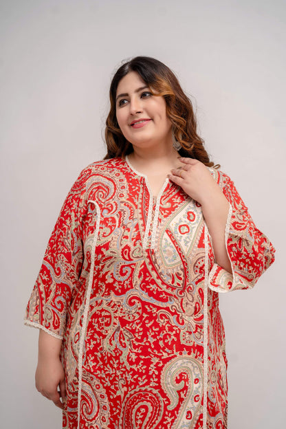 Portrait close view of red paisley rayon kurti with lace-trim notch neck, flattering on fat and curvy figures