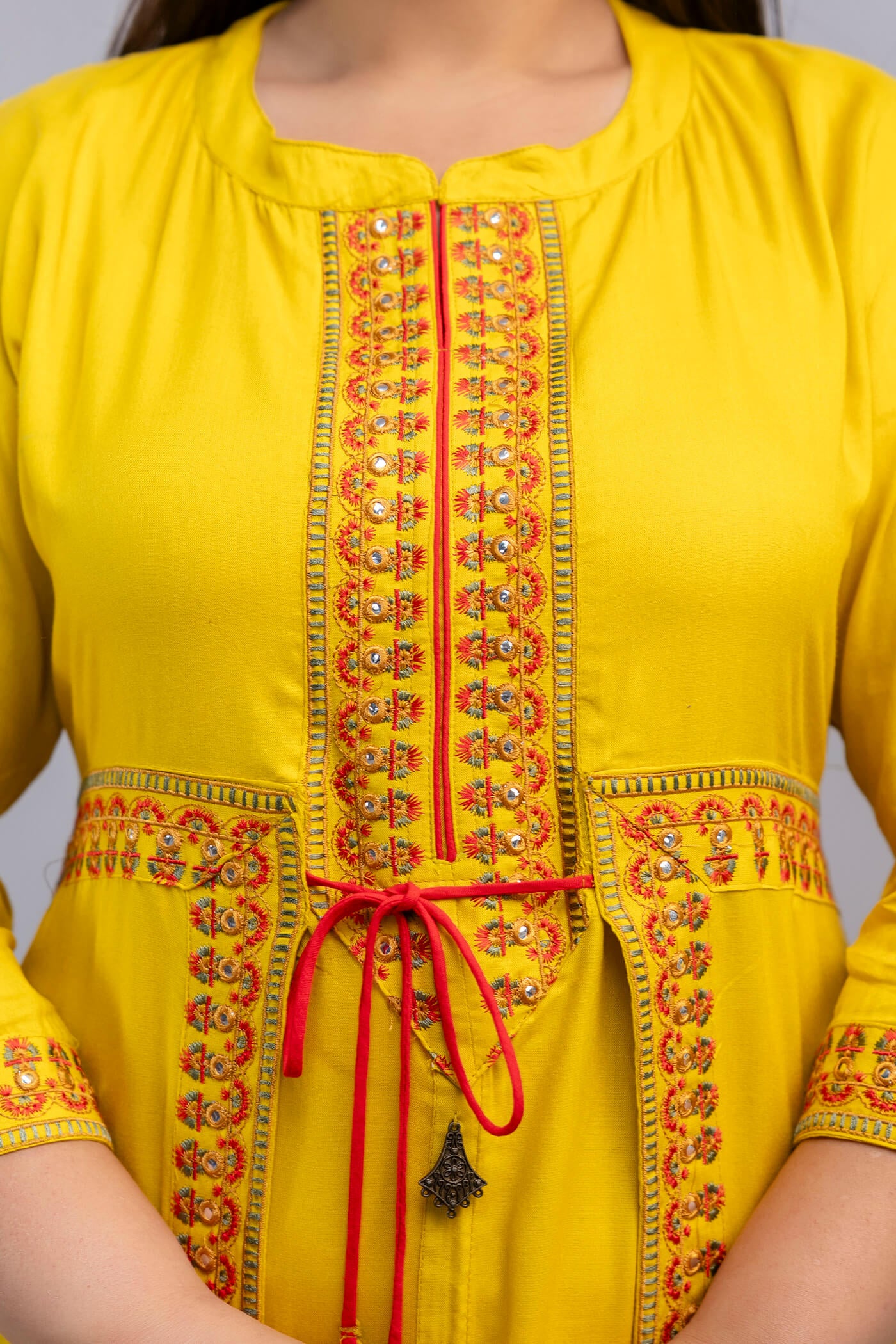 Detailed mirror style embroidery on yellow rayon gown for fat big size clothing