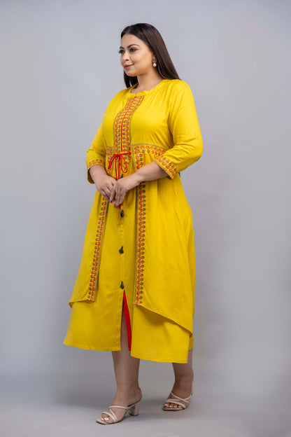 Full length pose of plus size yellow layered embroidered gown