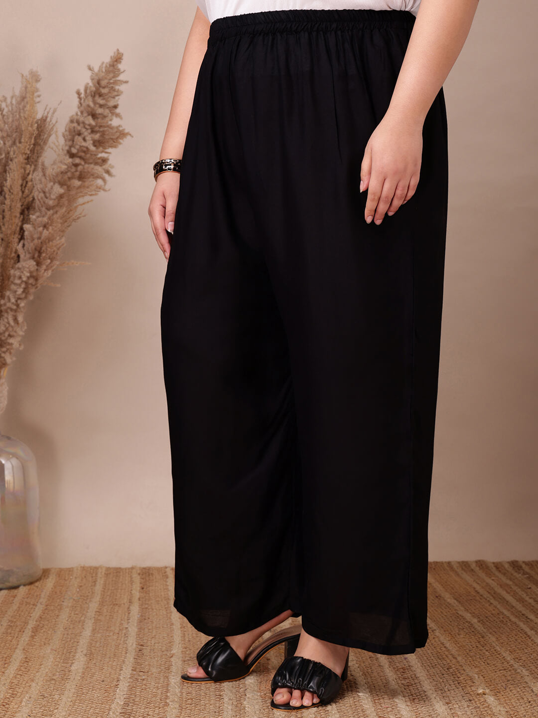 Front view of plus size black rayon palazzo pants with elastic waist and relaxed fit – Curvisha big size