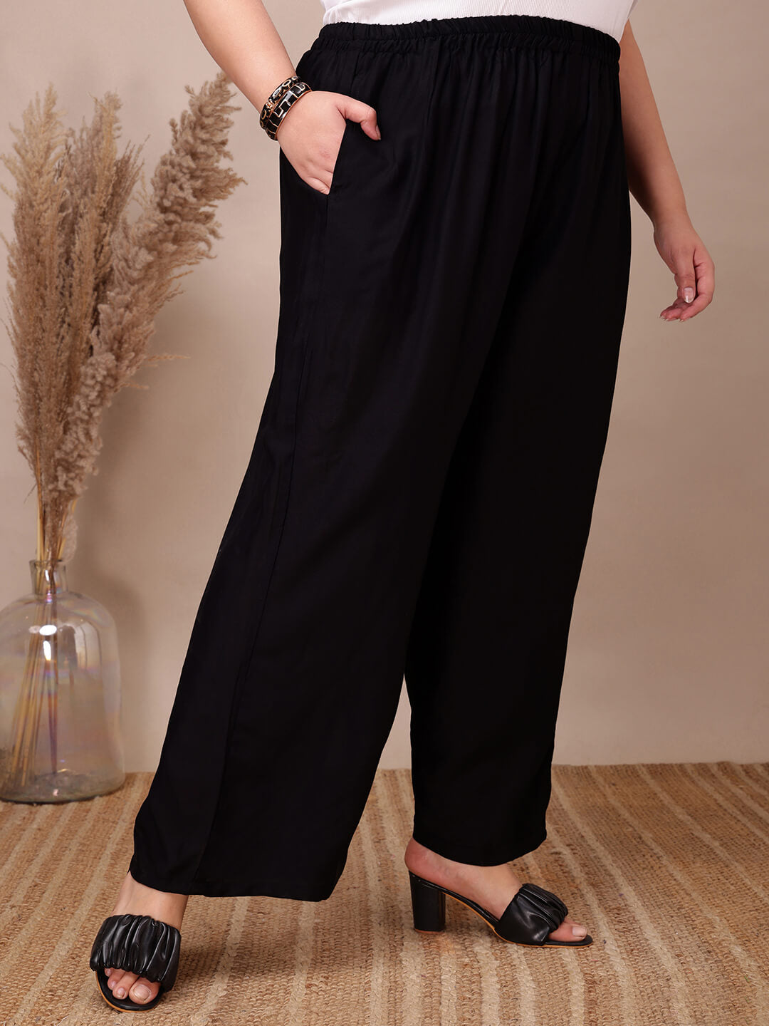 Side view of black rayon palazzo pants with pockets for fat women clothing, breathable rayon comfort