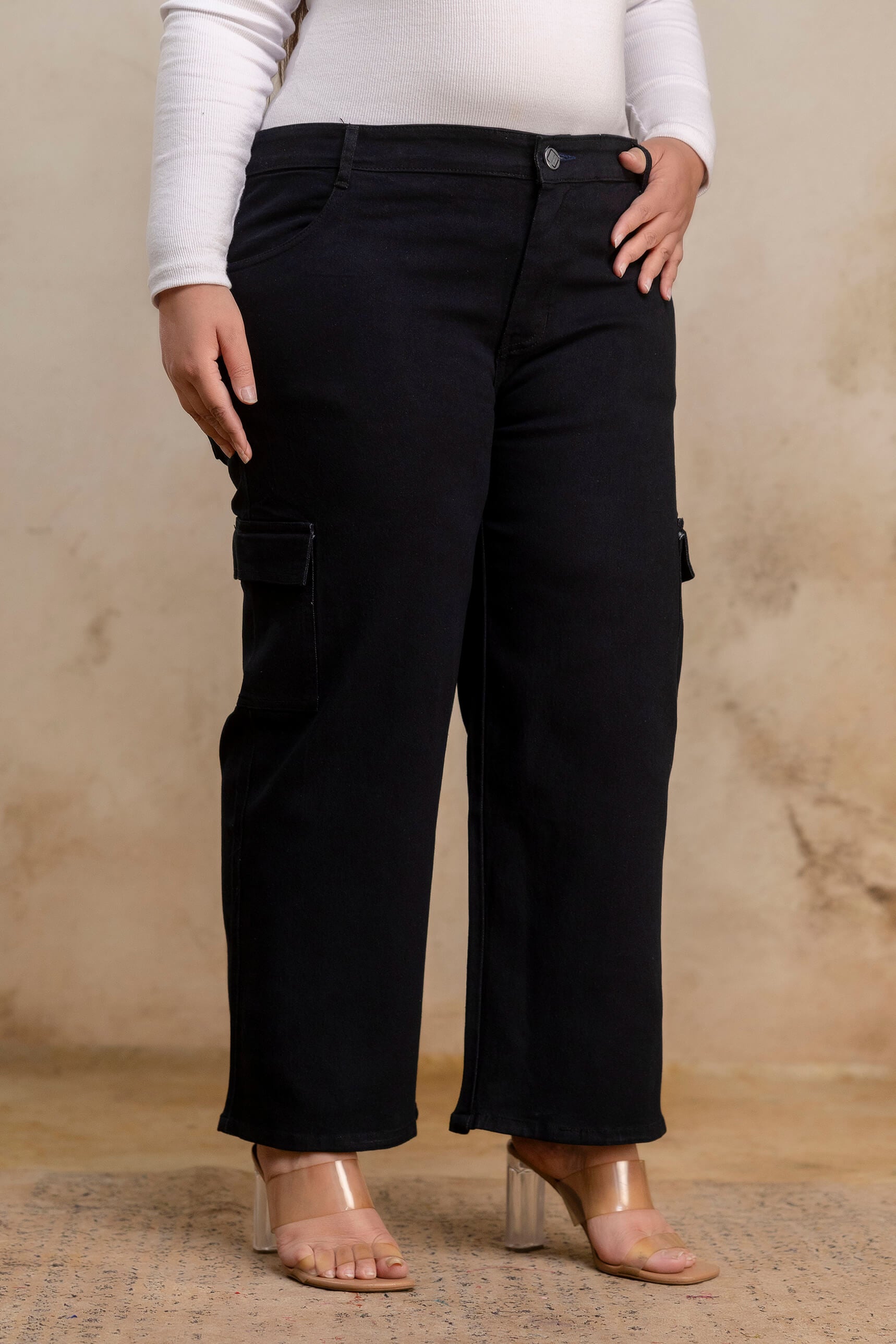 Plus size buttoned black denim pants angled view for women, wide leg big size clothing