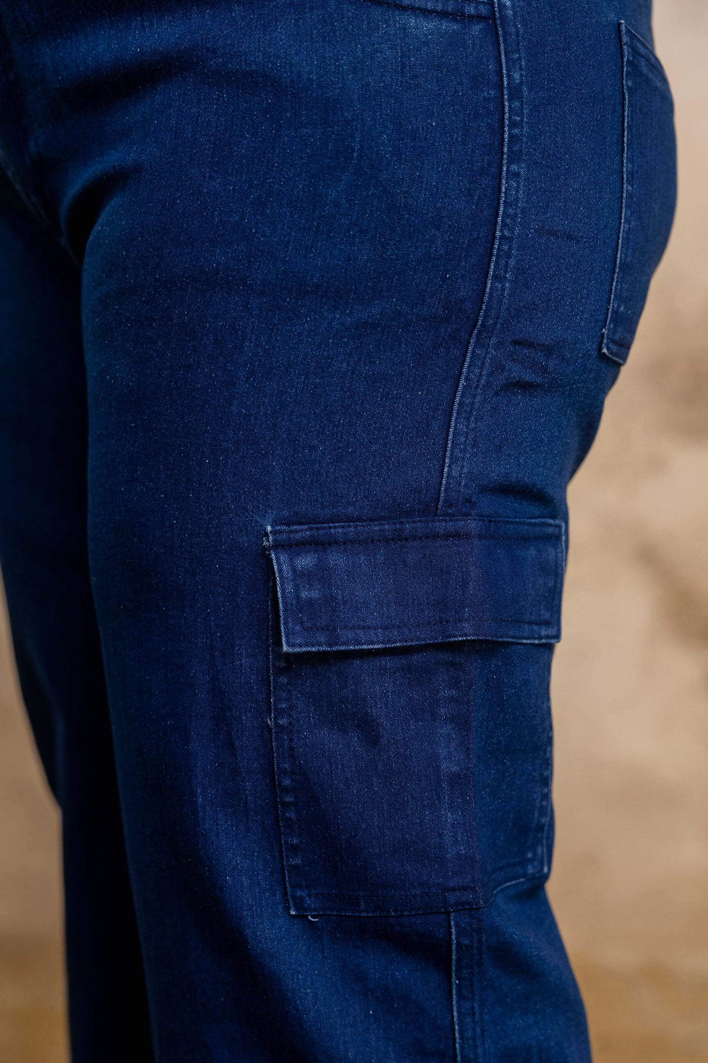 Plus size buttoned dark blue denim pants waist detail for fat women, big size clothing close up