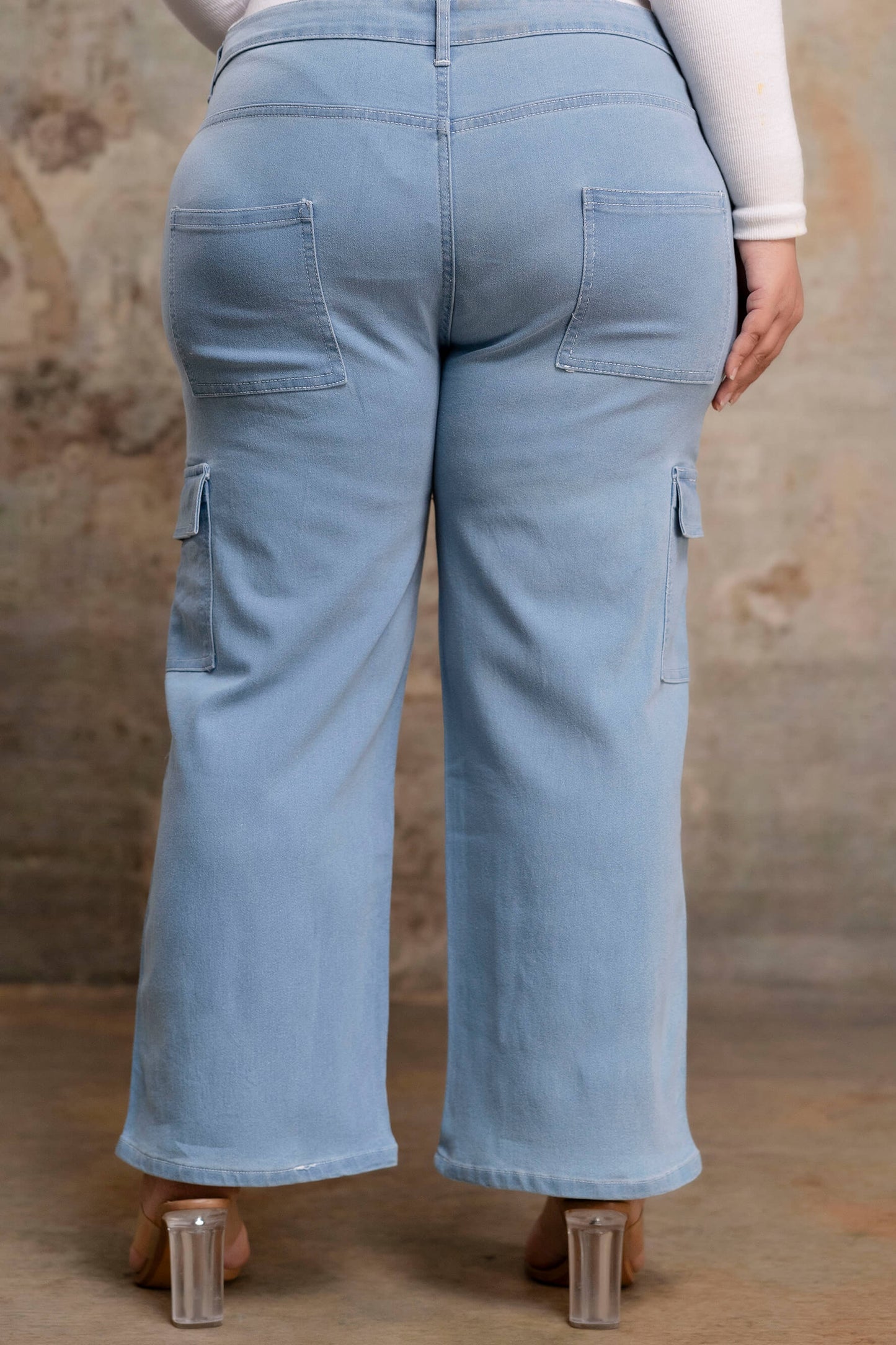 Plus size buttoned light blue denim pants back view for fat women, wide leg big size clothing