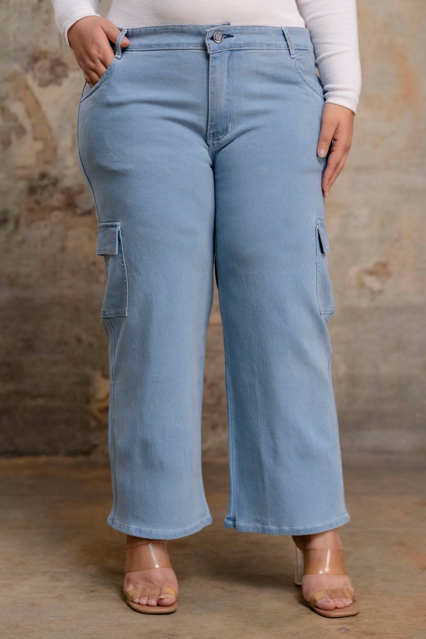 Plus size buttoned light blue denim pants for fat women, soft stretch big size clothing front view