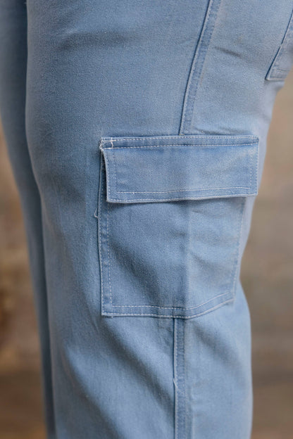 Plus size buttoned light blue denim pants side view for curvy women, wide leg big size clothing