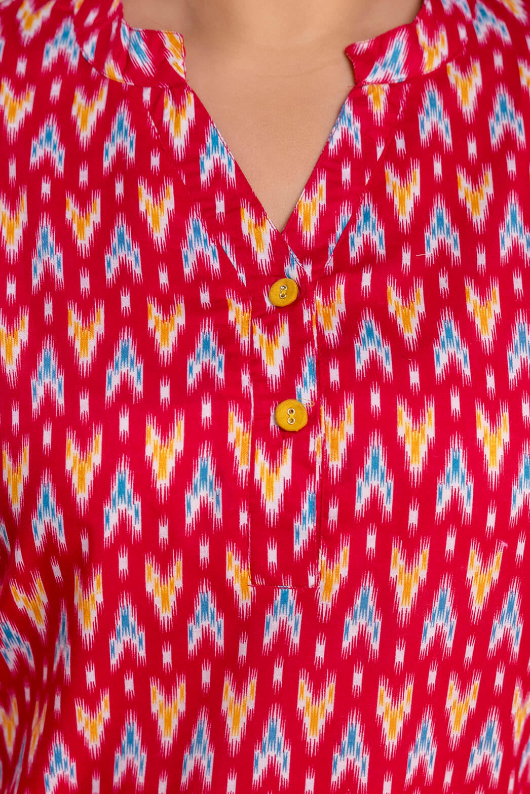 Close up button detail of plus size red ikat cotton short kurti