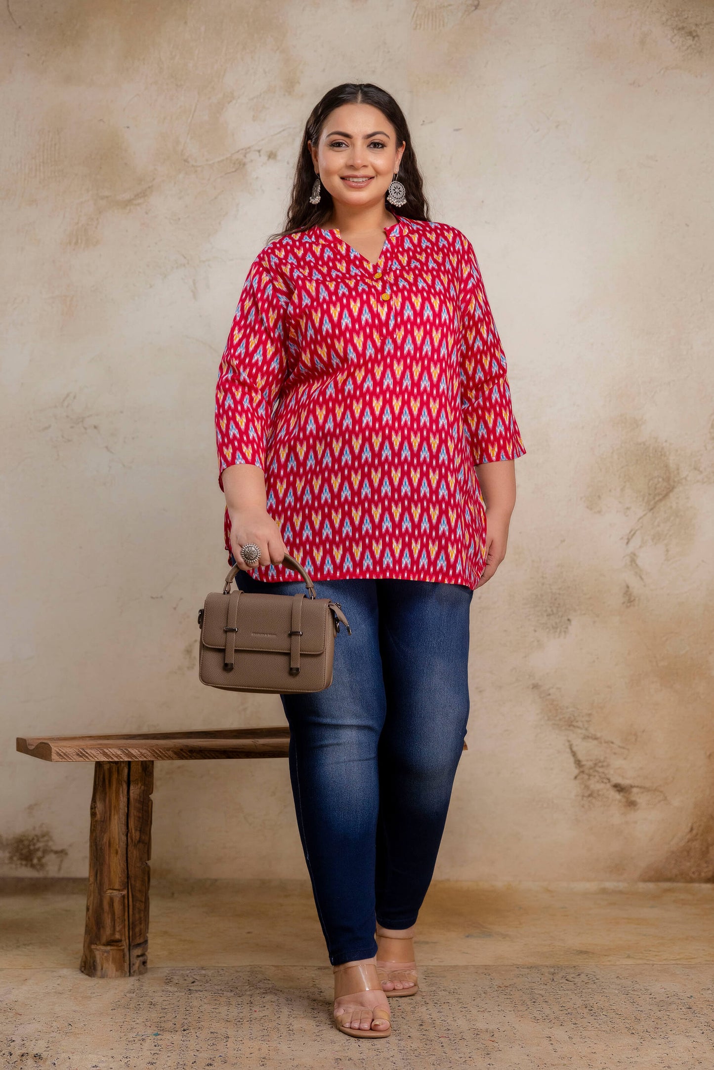 Lifestyle image of fat red ikat cotton short kurti tunic for casual wear