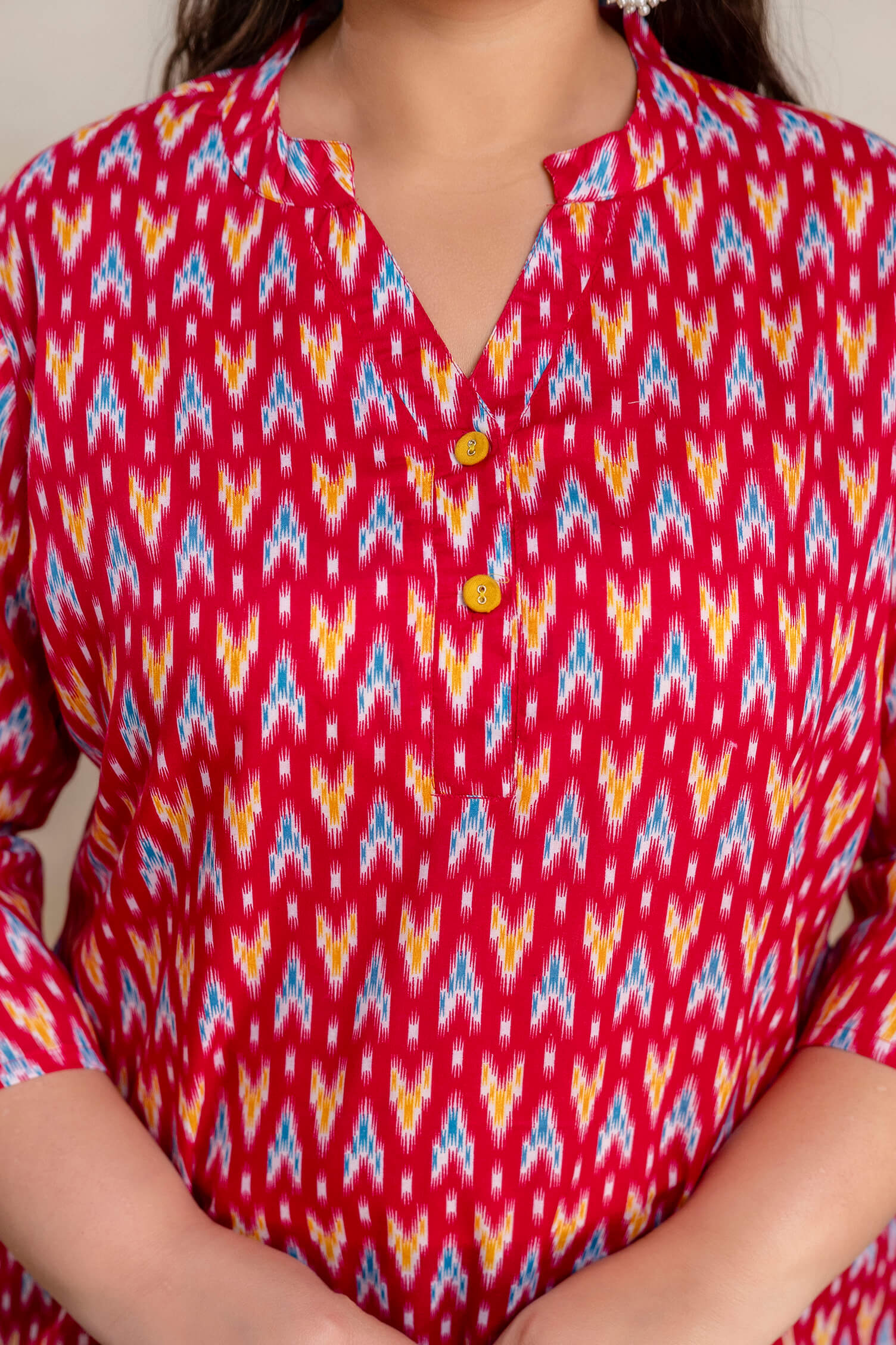 Close up neckline detail of plus size red ikat cotton short kurti