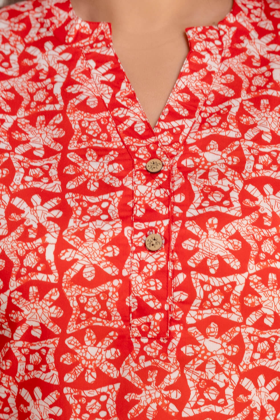 Lifestyle image of plus size red printed cotton short kurti tunic for fat and curvy women