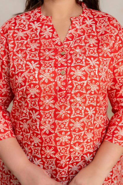 Close up neckline detail of plus size red printed cotton short kurti, wooden buttons cotton kurti