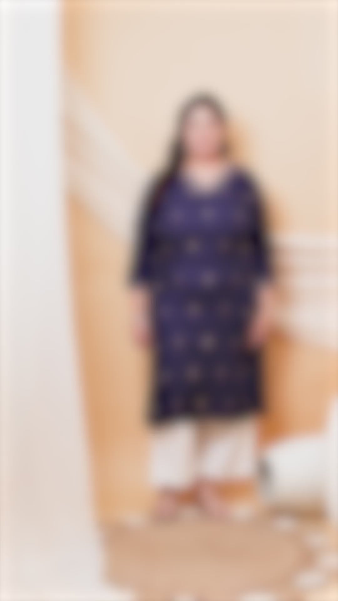 Classic navy blue plus size kurti for women with colorful star embroidery and embroidered cuffs.