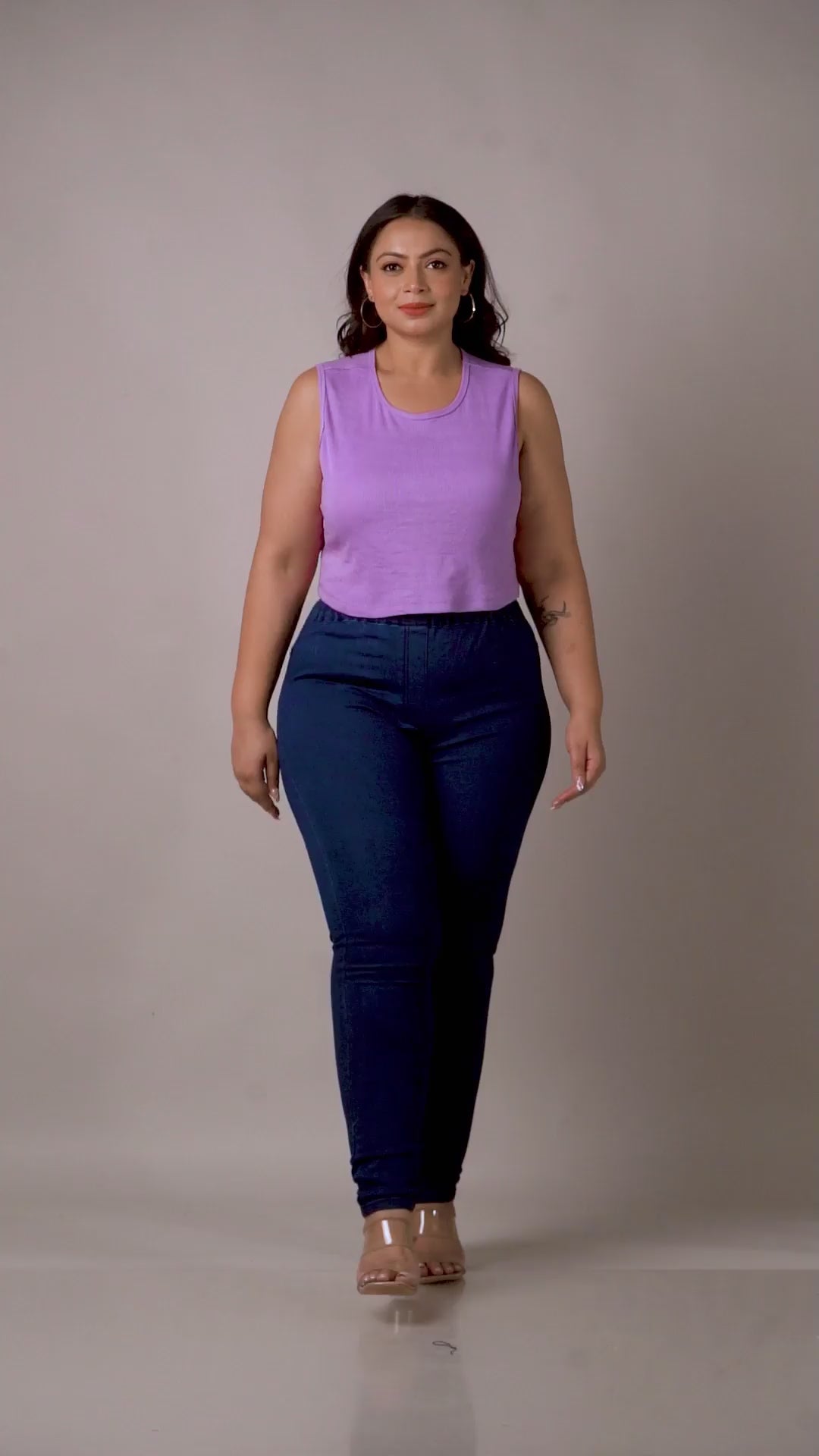 Detailed view of Curvisha denim jeggings with tummy control features in a sleek blue finish.