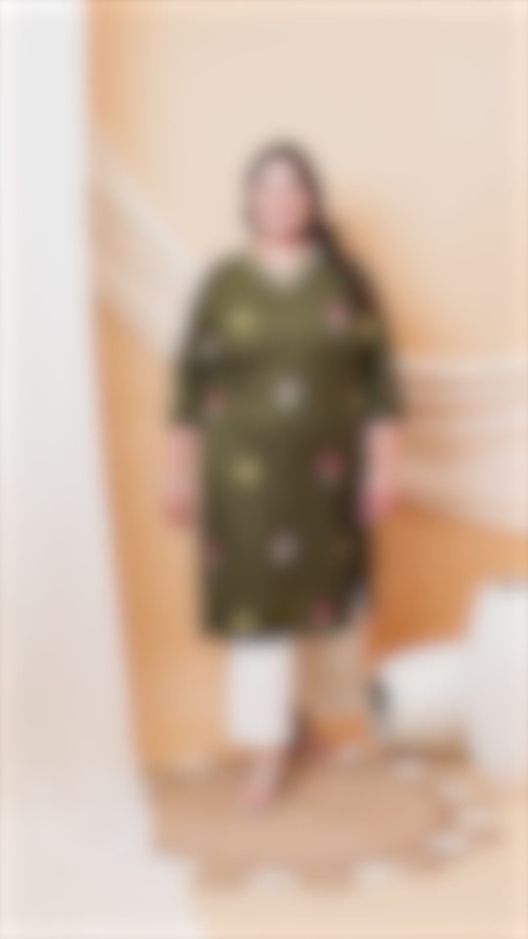 Sophisticated olive green plus size kurti with small floral embroidery and a striped V-neck border.