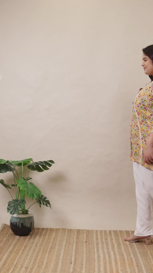 Curvisha plus size yellow paisley Angrakha kurti with adjustable waist ties for a comfortable ethnic fit.
