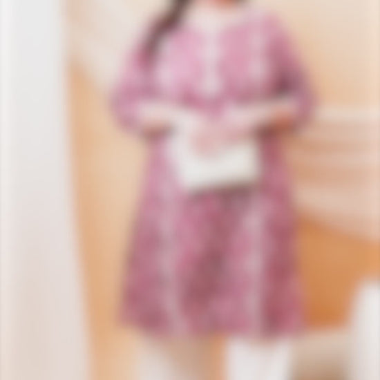 Women's plus size berry pink kurti featuring white floral motifs and delicate lace accents.