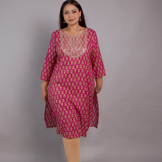 Vibrant magenta pink plus-size kurta by Curvisha with gold floral print and a detailed embroidered yoke, paired with gold heels.