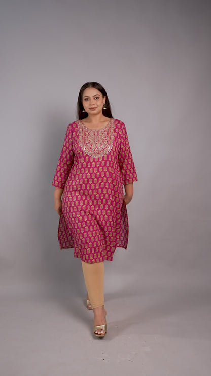 Vibrant magenta pink plus-size kurta by Curvisha with gold floral print and a detailed embroidered yoke, paired with gold heels.