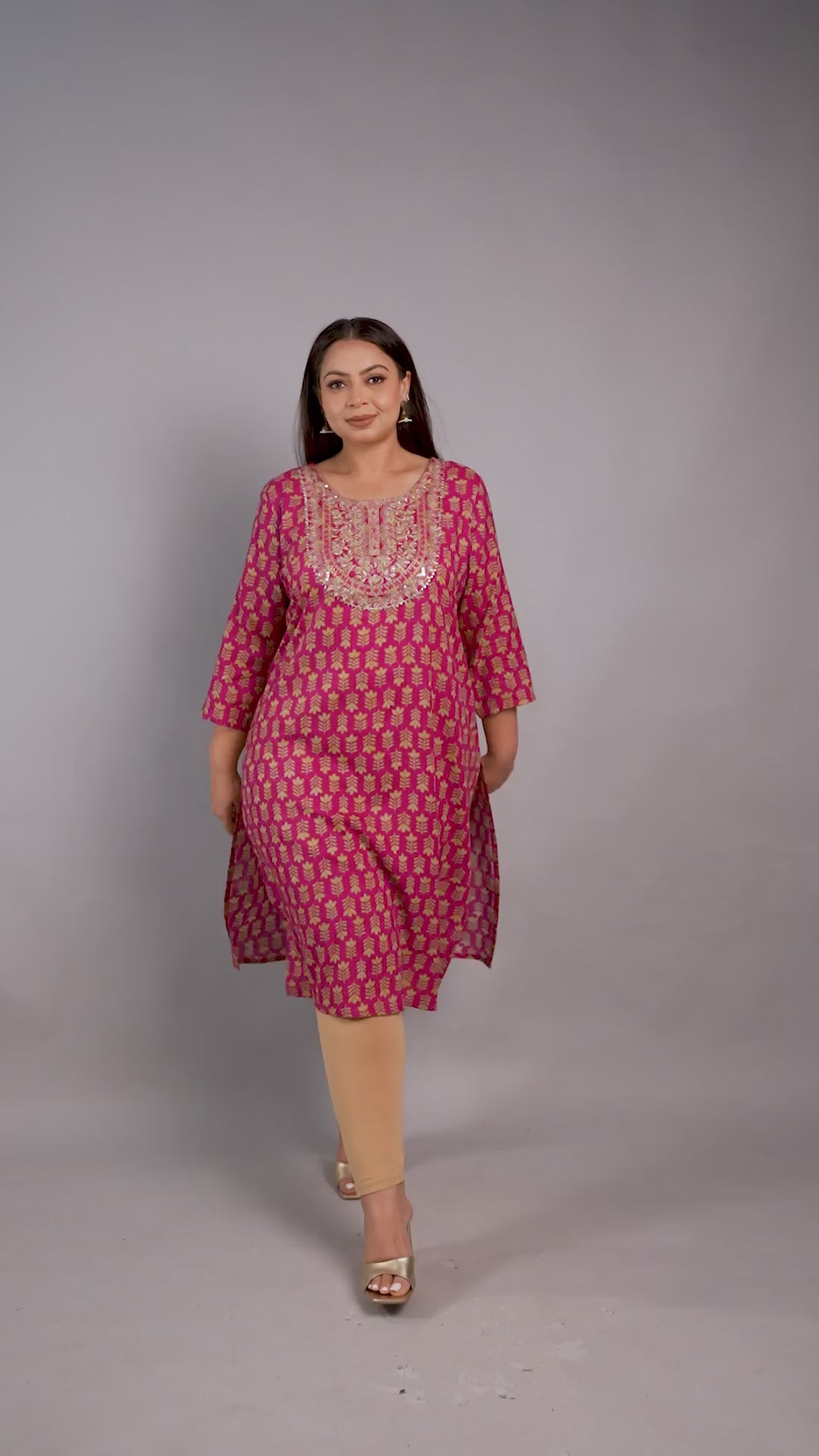 Vibrant magenta pink plus-size kurta by Curvisha with gold floral print and a detailed embroidered yoke, paired with gold heels.