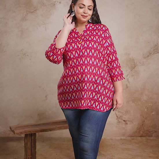 Trendy plus size red Ikat print short cotton kurti top by Curvisha, styled with jeans for a modern fusion look.