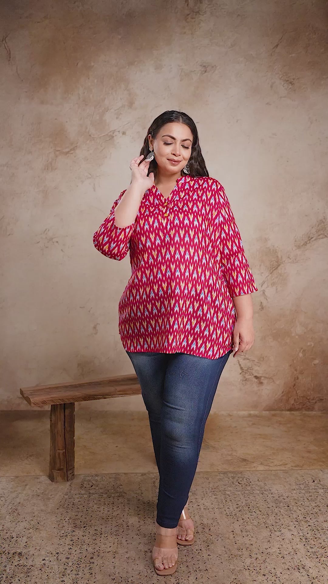 Trendy plus size red Ikat print short cotton kurti top by Curvisha, styled with jeans for a modern fusion look.
