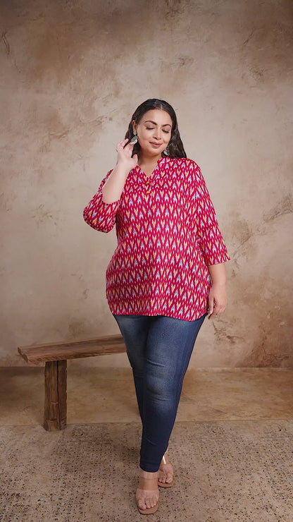 Trendy plus size red Ikat print short cotton kurti top by Curvisha, styled with jeans for a modern fusion look.