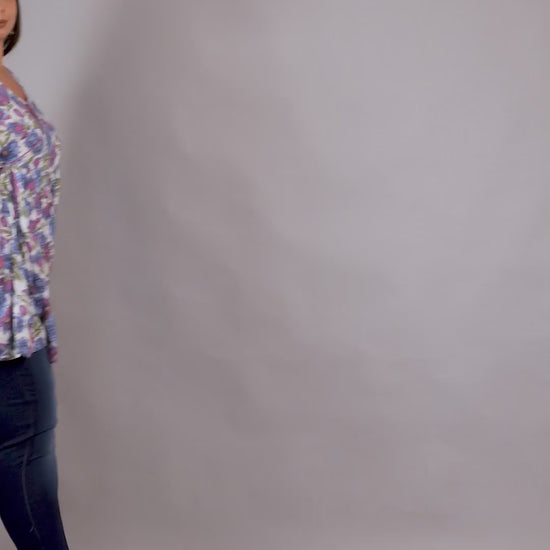 Feminine lilac floral plus size V-neck tunic by Curvisha with side tie detailing for an adjustable fit.