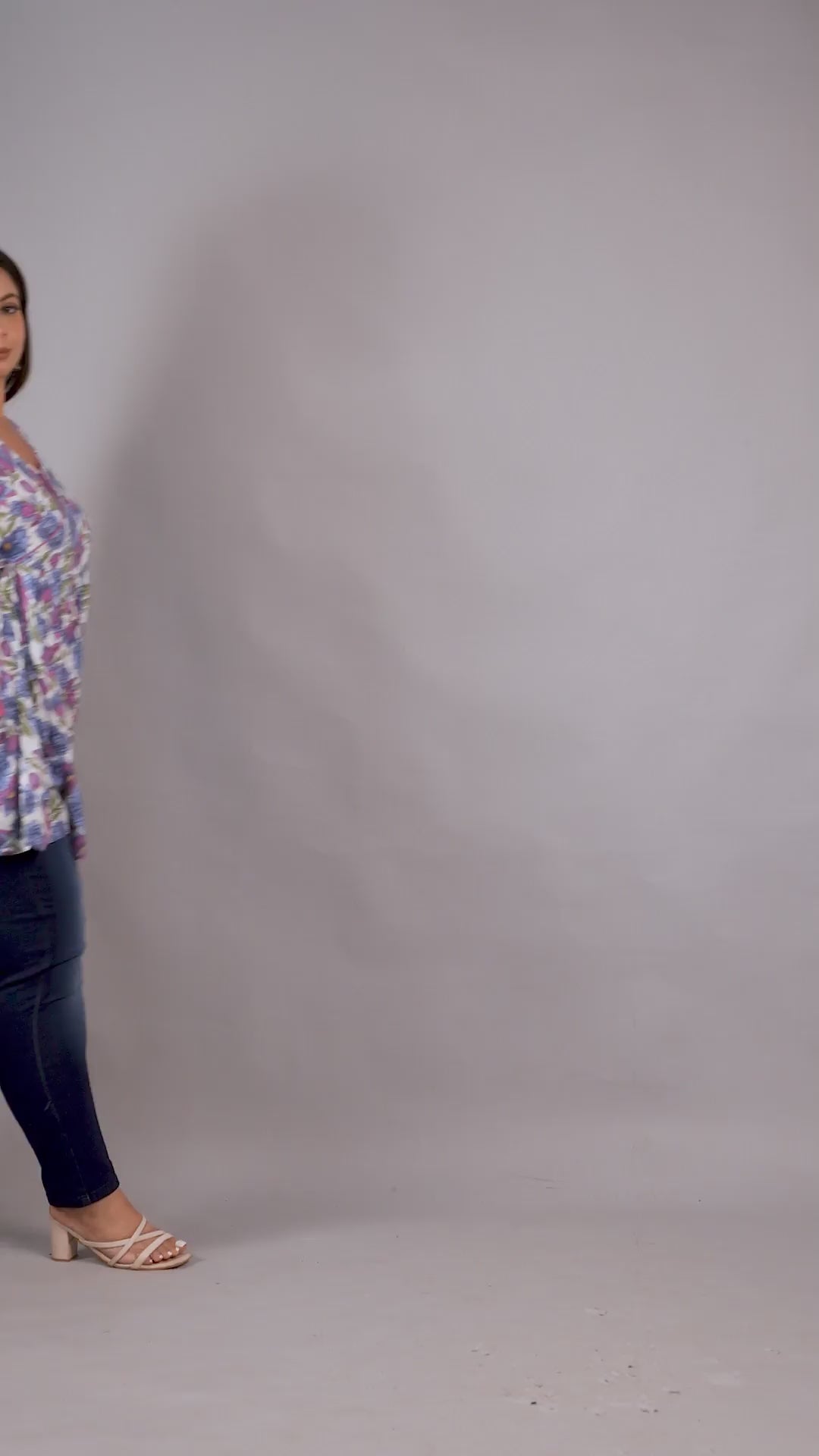 Feminine lilac floral plus size V-neck tunic by Curvisha with side tie detailing for an adjustable fit.