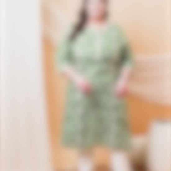 Plus size sage green kurti with white geometric print and lace detailing, ideal for daily ethnic wear.