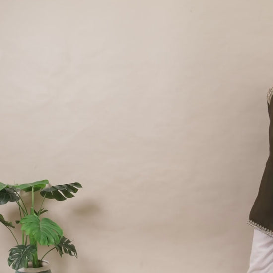 A plus-size model in a Curvisha dark olive green straight kurta with detailed silver embroidery on the yoke and sleeve cuffs.