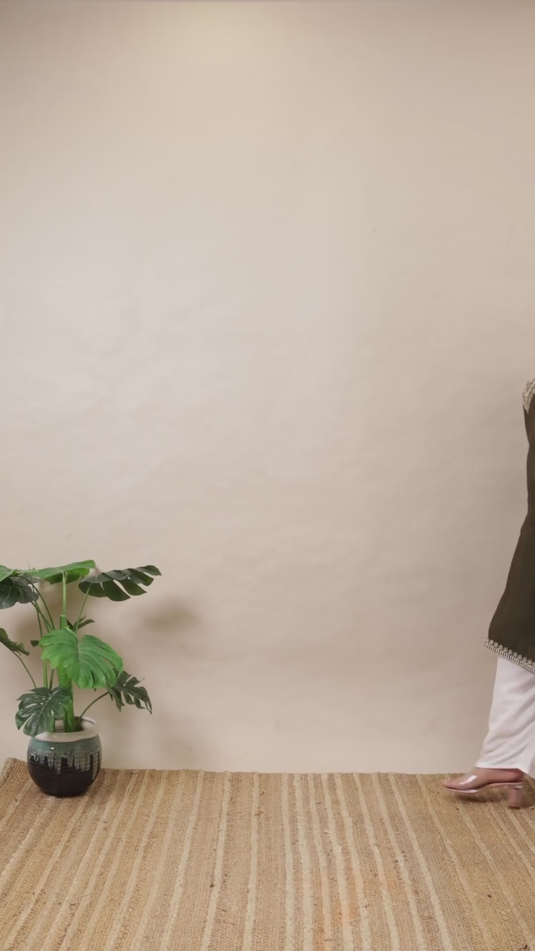 A plus-size model in a Curvisha dark olive green straight kurta with detailed silver embroidery on the yoke and sleeve cuffs.
