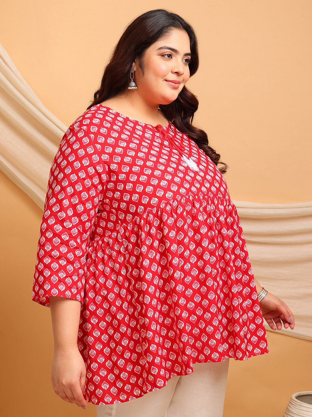 Detailed view of empire yoke and soft gathers on red printed rayon plus size short kurti tunic – Curvisha