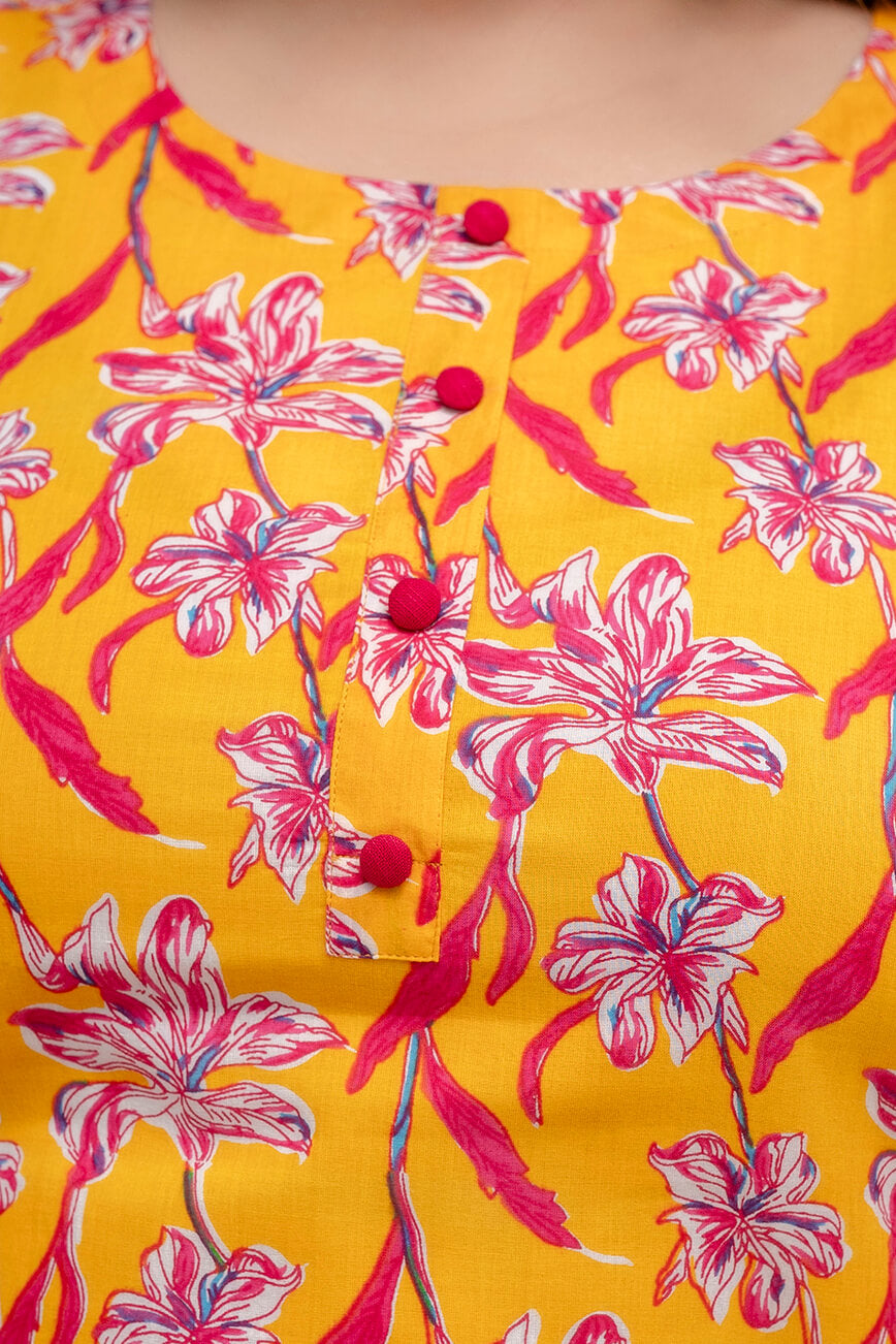Close-up of round neck and fabric buttons on yellow cotton kurti; casual detail for plus size fat women